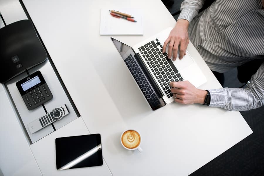 Typing on laptop